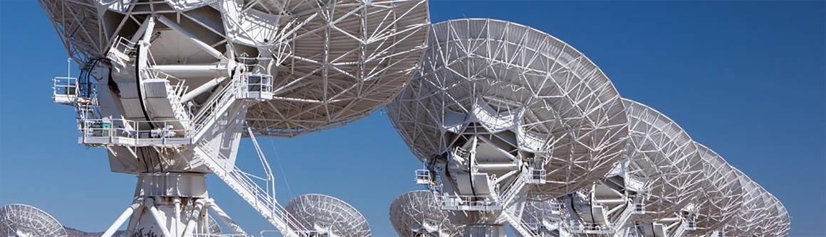 Satellite antennas against a blue sky